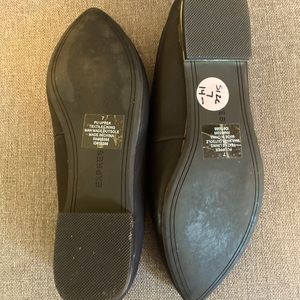 Express brand flats with a gold band on 1/2” heal.